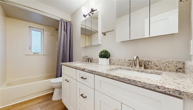 7845 Clubhouse Estates Dr, Orlando, FL 32819 - full bathroom with shower / bath combination with curtain, wood finished floors, a sink, and toilet