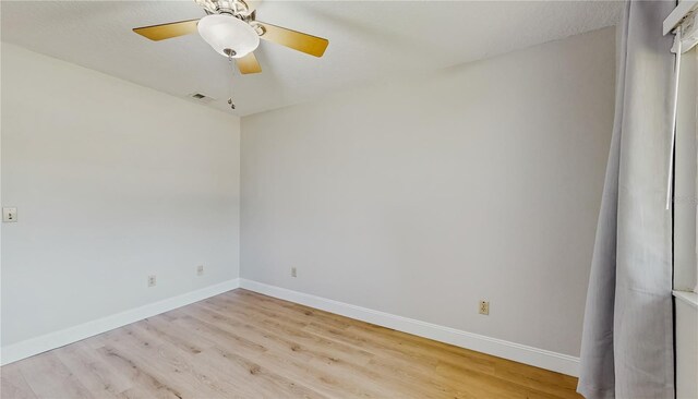 7845 Clubhouse Estates Dr, Orlando, FL 32819 - empty room featuring visible vents, baseboards, wood finished floors, and ceiling fan