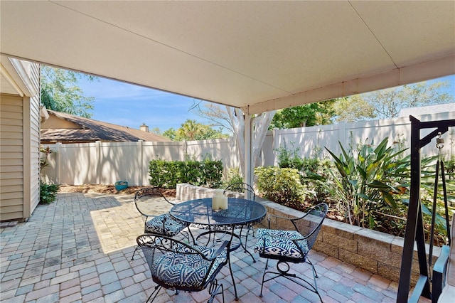 7845 Clubhouse Estates Dr, Orlando, FL 32819 - view of patio / terrace with outdoor dining area and a fenced backyard
