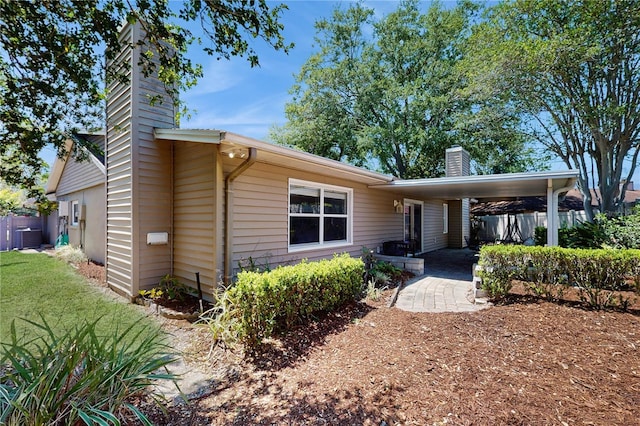 7845 Clubhouse Estates Dr, Orlando, FL 32819 - ranch-style house featuring central air condition unit, a chimney, and fence