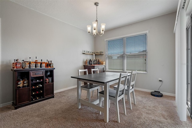 1918 Marabou Dr, Davenport, FL 33896 - dining area with baseboards, a notable chandelier, and carpet flooring