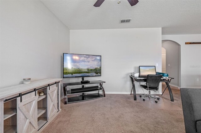 1918 Marabou Dr, Davenport, FL 33896 - carpeted office space featuring visible vents, a ceiling fan, arched walkways, baseboards, and a textured ceiling