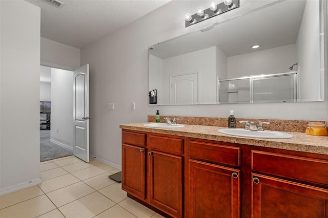 1918 Marabou Dr, Davenport, FL 33896 - full bathroom with a shower stall, tile patterned floors, a sink, and double vanity