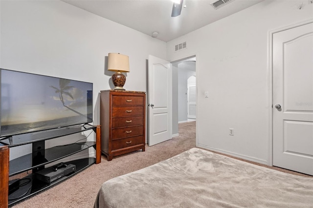 1918 Marabou Dr, Davenport, FL 33896 - bedroom with light carpet, visible vents, arched walkways, and ceiling fan