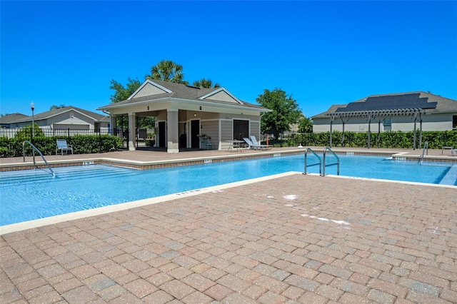 1918 Marabou Dr, Davenport, FL 33896 - community pool with fence, a pergola, and a patio