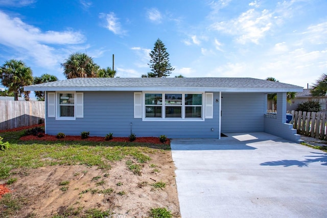 single story home featuring fence and driveway