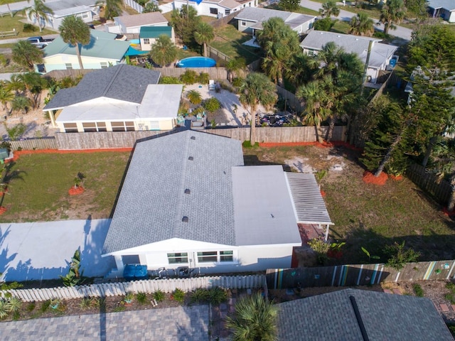 birds eye view of property with a residential view