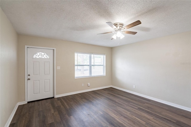 1411 N Powers Dr, Orlando, FL 32818 - entrance foyer featuring a ceiling fan, baseboards, a textured ceiling, and dark wood-type flooring