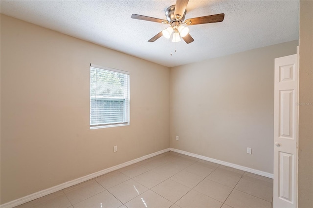 1411 N Powers Dr, Orlando, FL 32818 - unfurnished room featuring baseboards, a ceiling fan, a textured ceiling, and light tile patterned flooring