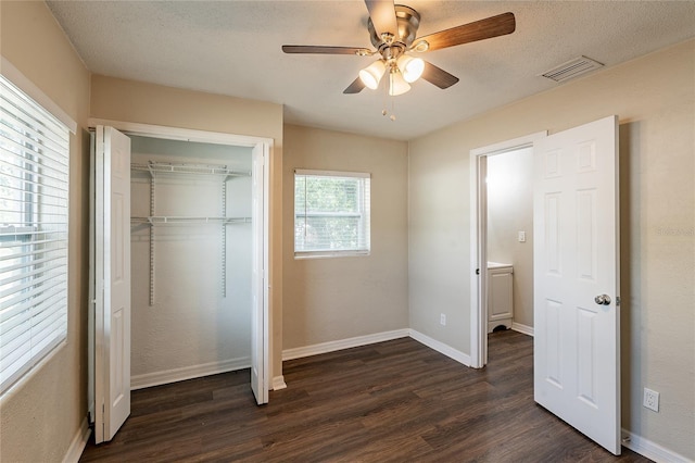 1411 N Powers Dr, Orlando, FL 32818 - unfurnished bedroom featuring a ceiling fan, a closet, visible vents, baseboards, and dark wood-style floors