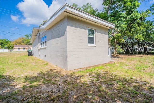 1411 N Powers Dr, Orlando, FL 32818 - view of side of home featuring a lawn