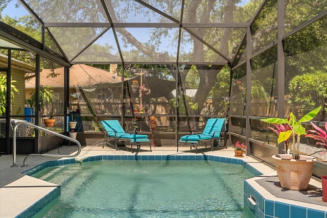 outdoor pool featuring a patio area and glass enclosure