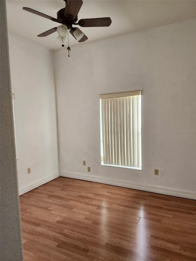 4666 Clarke St, North Port, FL 34286 - unfurnished room with wood finished floors, ceiling fan, and baseboards