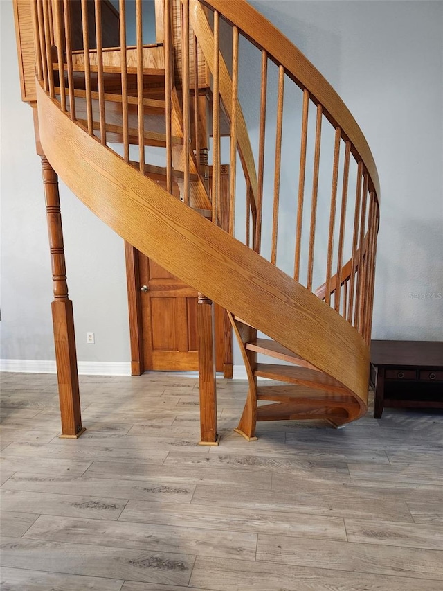 4666 Clarke St, North Port, FL 34286 - stairs with wood finished floors and baseboards