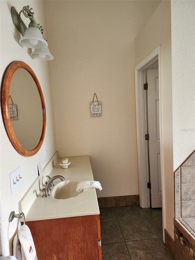 4666 Clarke St, North Port, FL 34286 - bathroom with vanity, tile patterned floors, and baseboards