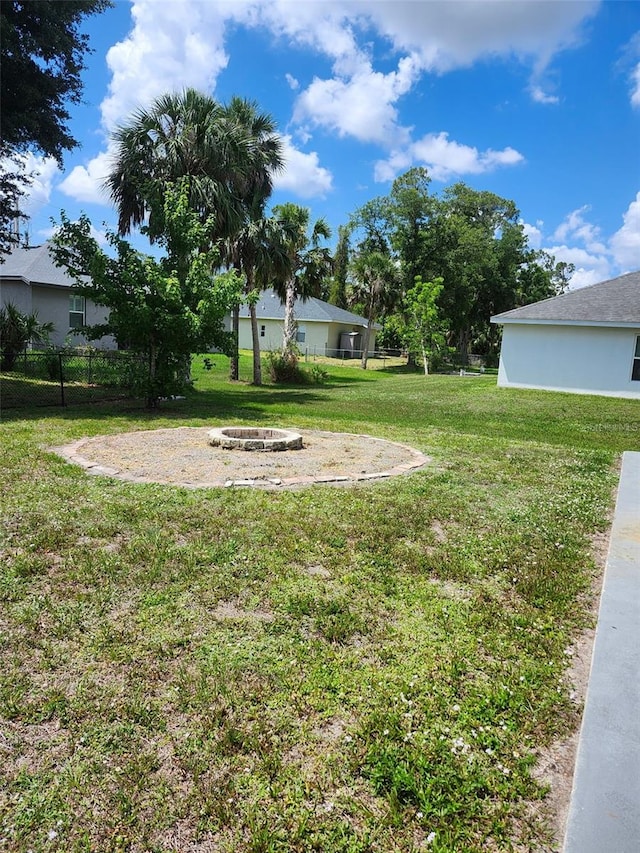 4666 Clarke St, North Port, FL 34286 - view of yard with an outdoor fire pit