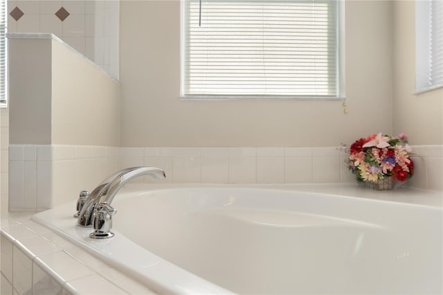 full bathroom featuring a bath and plenty of natural light