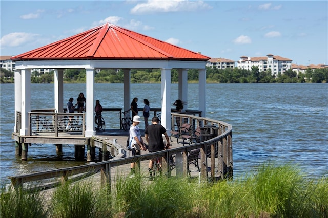 dock area with a gazebo and a water view