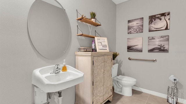 2690 Trinidad Rd, Haines City, FL 33844 - half bath featuring tile patterned flooring, baseboards, and toilet