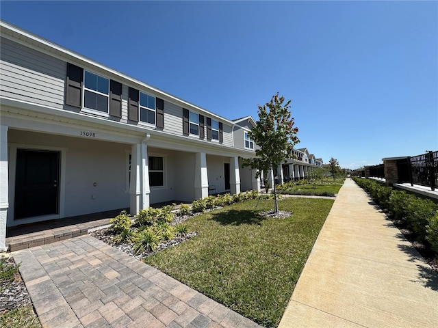 view of side of property featuring a yard