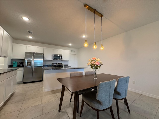 dining space featuring recessed lighting, light tile patterned floors, visible vents, and baseboards