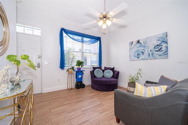 4011 Venetian Bay Dr Unit 103, Kissimmee, FL 34741 - living area with light wood-style flooring, baseboards, and a ceiling fan