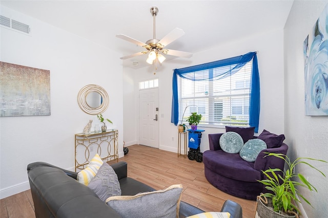 4011 Venetian Bay Dr Unit 103, Kissimmee, FL 34741 - living room with wood finished floors, ceiling fan, and baseboards
