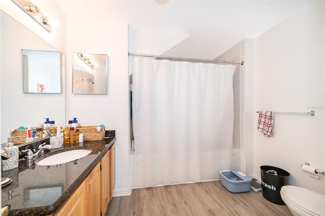 4011 Venetian Bay Dr Unit 103, Kissimmee, FL 34741 - full bath with shower / tub combo with curtain, vanity, toilet, and wood finished floors