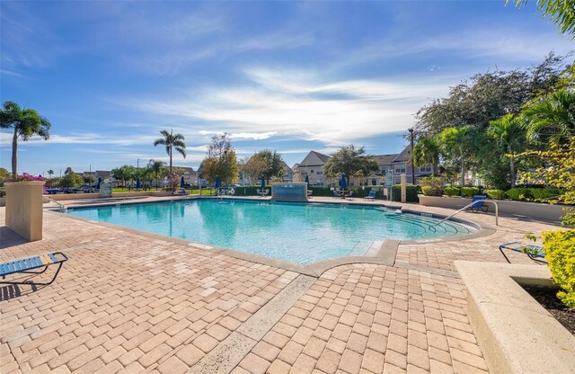 4011 Venetian Bay Dr Unit 103, Kissimmee, FL 34741 - community pool featuring a patio