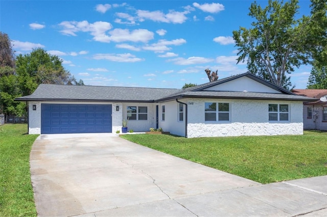 ranch-style house with an attached garage, driveway, a front yard, and stucco siding