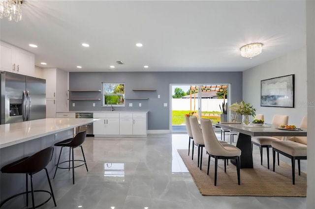 dining area with recessed lighting, visible vents, and baseboards