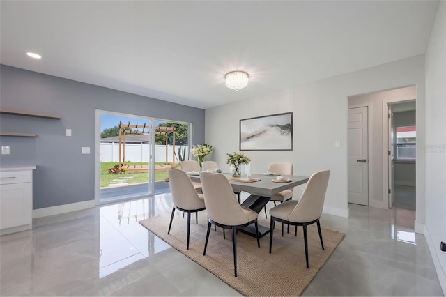 dining area with baseboards and recessed lighting