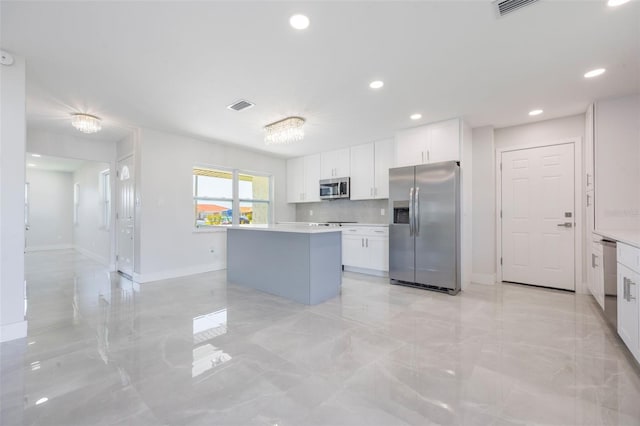kitchen with white cabinets, stainless steel appliances, visible vents, and recessed lighting