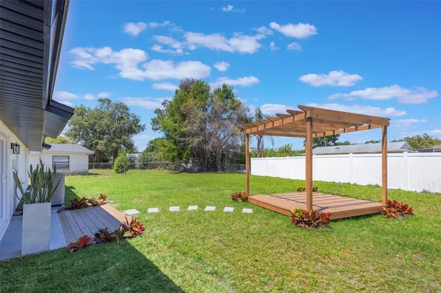 view of yard with a pergola, a fenced backyard, and a wooden deck