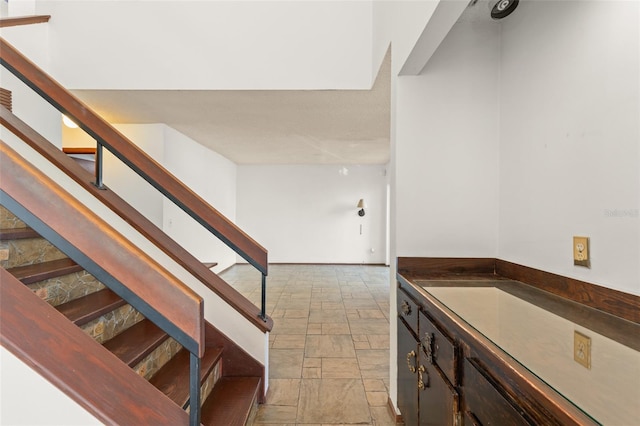 stairs with stone tile floors