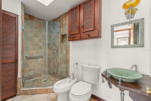 full bathroom featuring a sink, toilet, a stall shower, a bidet, and a closet