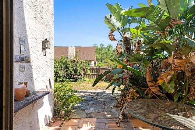 view of patio / terrace featuring fence