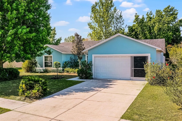 ranch-style home with a shingled roof, a garage, stucco siding, a front yard, and concrete driveway