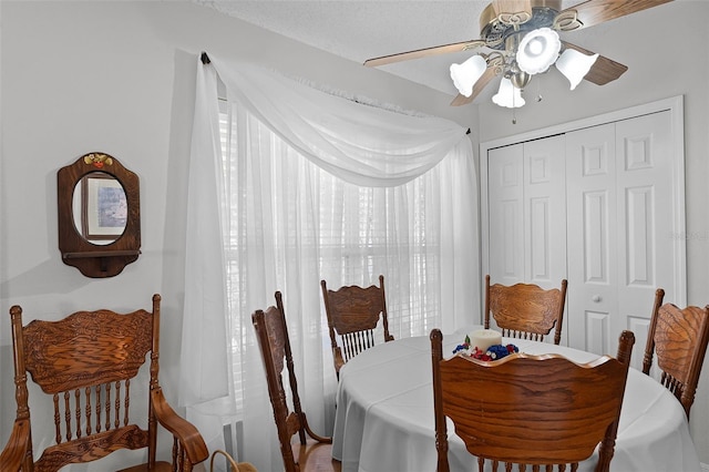 dining space featuring ceiling fan