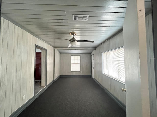 unfurnished sunroom featuring visible vents