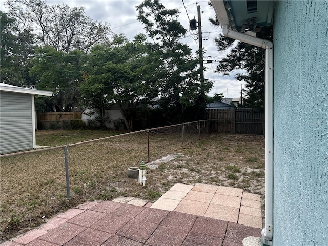 view of yard with a patio area and fence