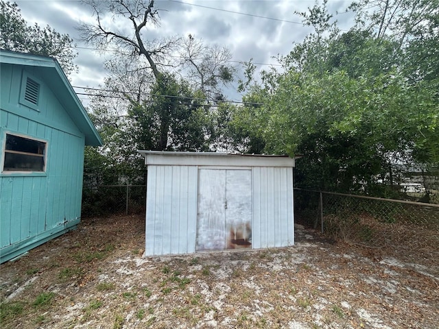 view of shed with a fenced backyard