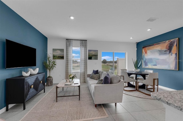 1409 Fan Palm Dr, Davenport, FL 33897 - living room featuring visible vents, baseboards, recessed lighting, and light tile patterned flooring