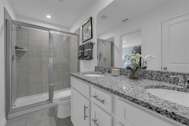 1409 Fan Palm Dr, Davenport, FL 33897 - full bathroom featuring toilet, tile patterned floors, a sink, and a stall shower