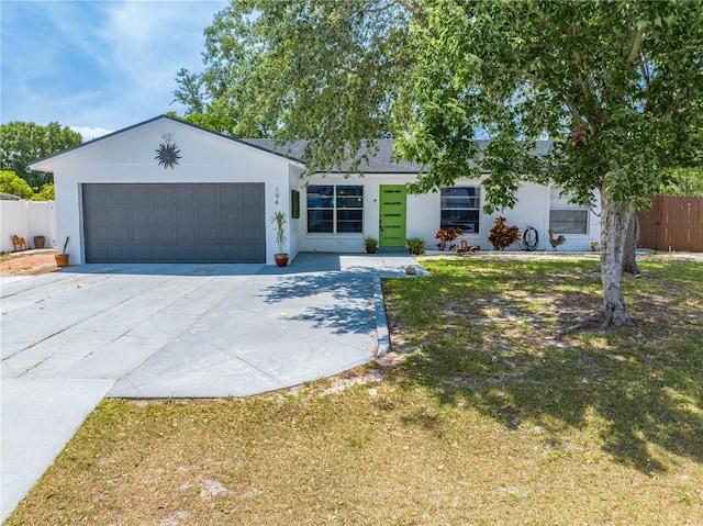 194 Larkspur Ct, Kissimmee, FL 34743 - ranch-style house featuring stucco siding, driveway, and a garage