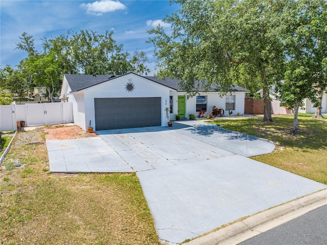 194 Larkspur Ct, Kissimmee, FL 34743 - ranch-style house featuring a gate, stucco siding, concrete driveway, a front yard, and a garage