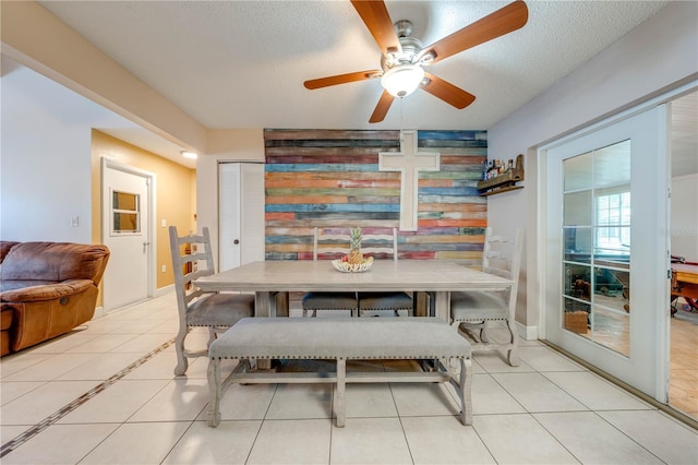 194 Larkspur Ct, Kissimmee, FL 34743 - dining area with a ceiling fan, a textured ceiling, and light tile patterned floors
