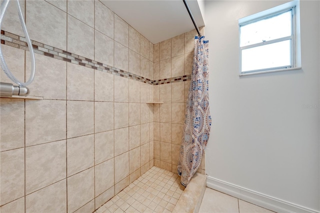 194 Larkspur Ct, Kissimmee, FL 34743 - bathroom featuring a tile shower and baseboards