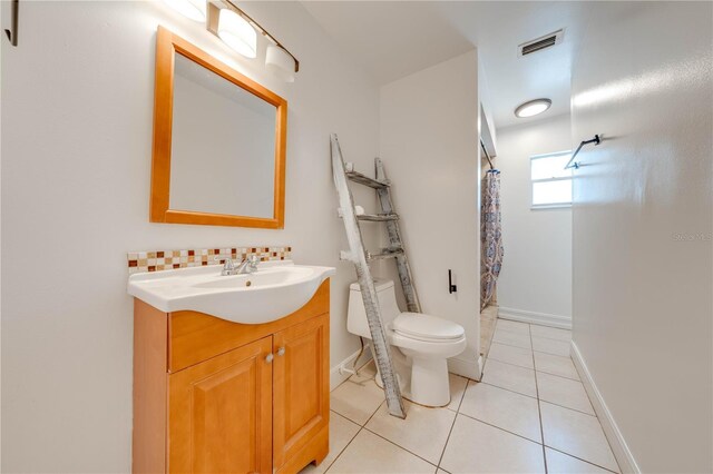 194 Larkspur Ct, Kissimmee, FL 34743 - bathroom with tile patterned floors, toilet, visible vents, a shower with shower curtain, and vanity