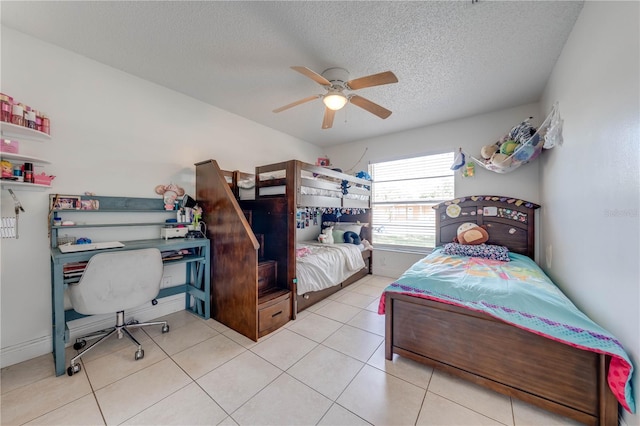 194 Larkspur Ct, Kissimmee, FL 34743 - bedroom with a textured ceiling, tile patterned flooring, and ceiling fan